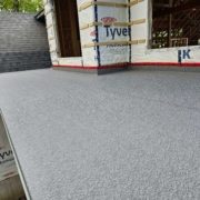 DeckRite vinyl membrane installed on an outdoor deck, showcasing its seamless and water-resistant finish.